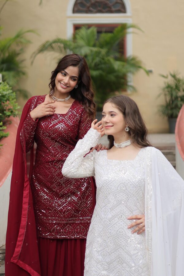 Premium Designer Sharara Suit in White and Maroon, featuring sequins and thread embroidery on faux georgette, paired with a flowing sharara and embroidered dupatta.