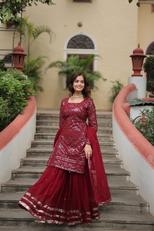 Premium Designer Sharara Suit in White and Maroon, featuring sequins and thread embroidery on faux georgette, paired with a flowing sharara and embroidered dupatta.