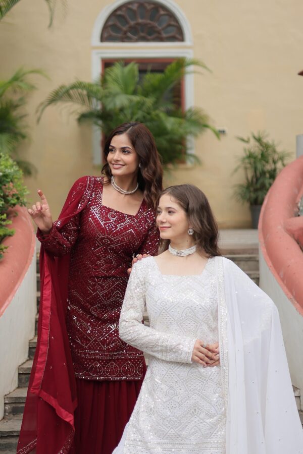 Premium Designer Sharara Suit in White and Maroon, featuring sequins and thread embroidery on faux georgette, paired with a flowing sharara and embroidered dupatta