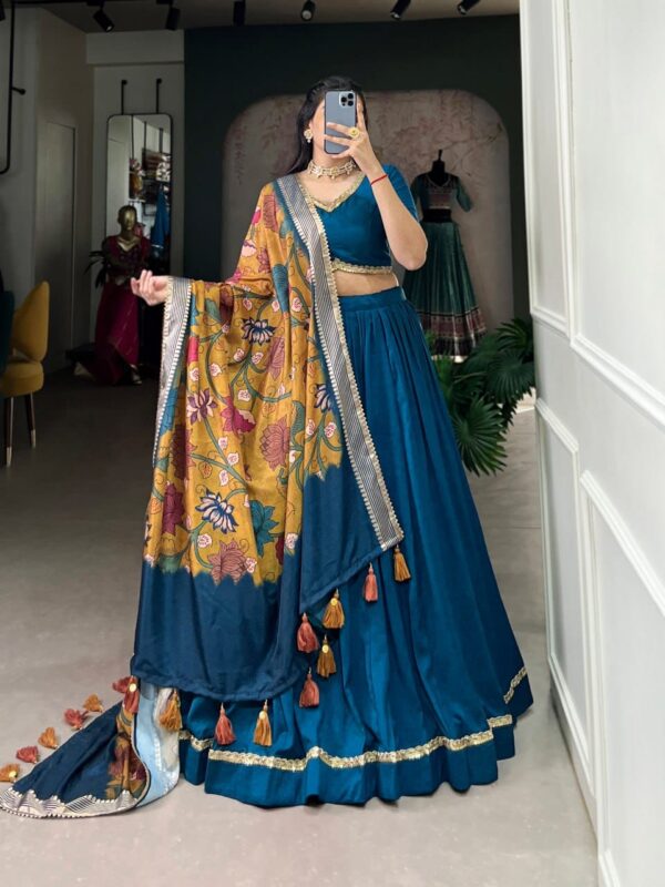 Elegant Chinon Silk Wedding Lehenga set featuring lace details, a Tussar Silk dupatta with tassels, and a plain yet sophisticated design for modern celebrations.