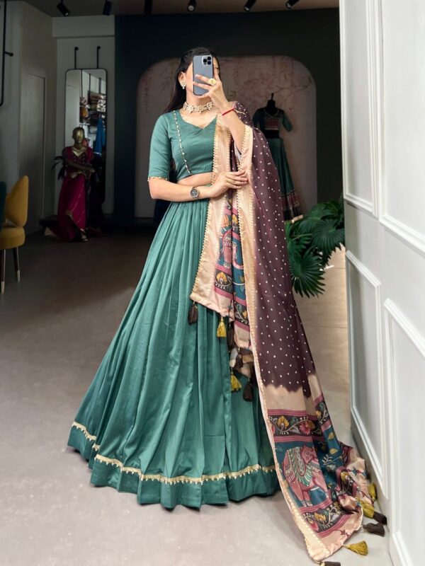 Elegant Chinon Silk Wedding Lehenga set featuring lace details, a Tussar Silk dupatta with tassels, and a plain yet sophisticated design for modern celebrations.